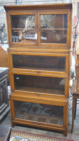 An early 20th century Globe Wernicke style oak four section glazed bookcase, width 87cm, depth 32cm, height 179cm